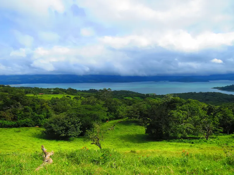 Arenal Volcano rising above the rainforest and Lake Arenal