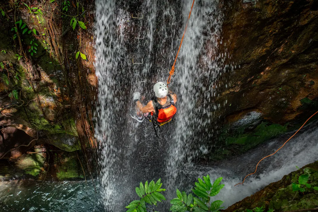 River tubing through Class 2-3 rapids in jungle, Costa Rica
