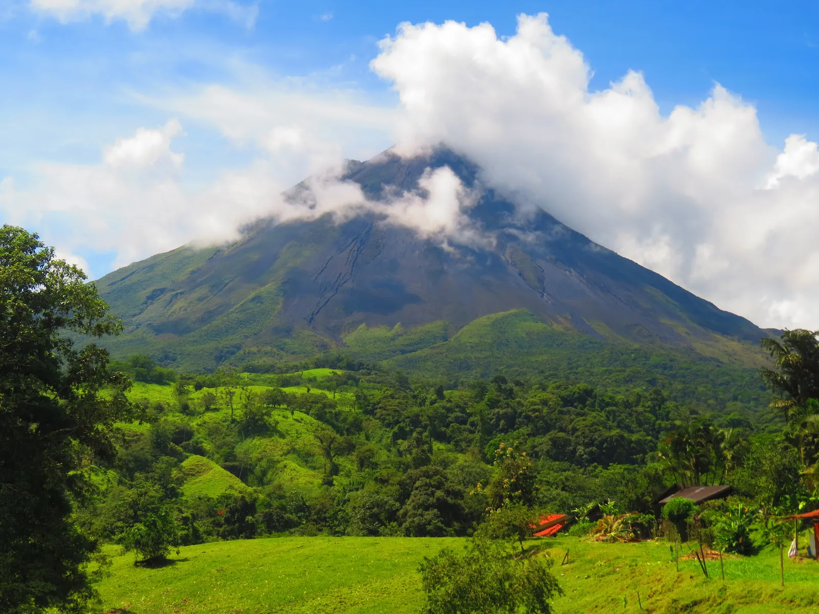 Aerial view of Arenal Volcano and tropical rainforest during a domestic flight to La Fortuna, Costa Rica