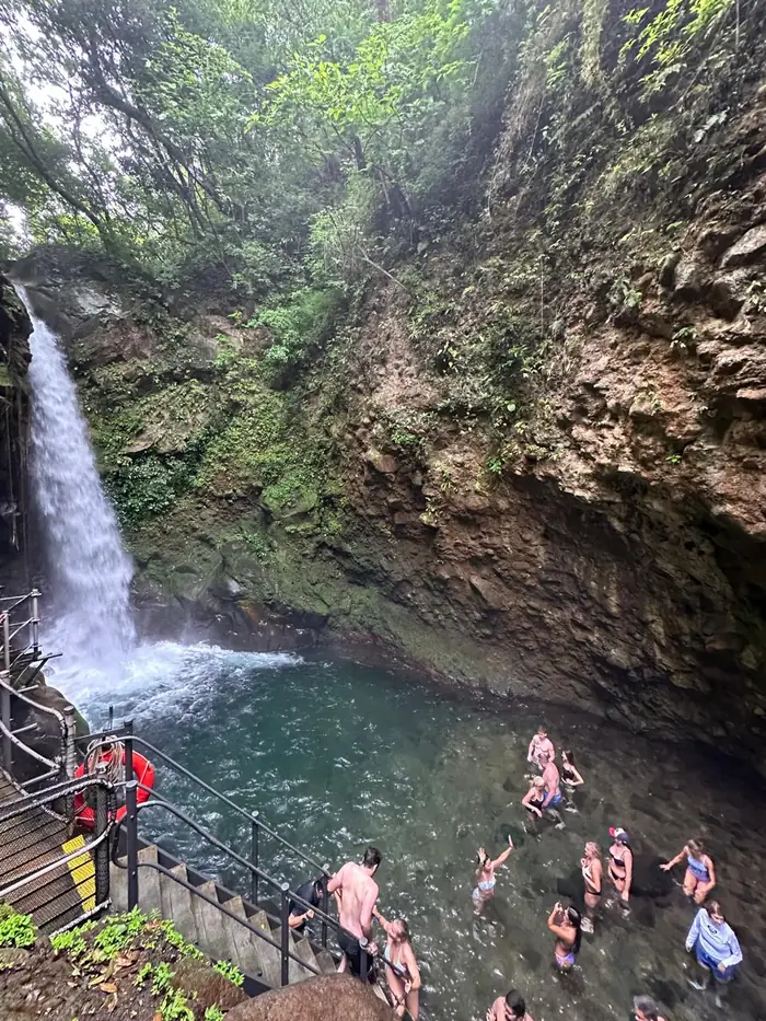 Oropendola Waterfall falling into a crystal-clear pool, Guanacaste, Costa Rica
